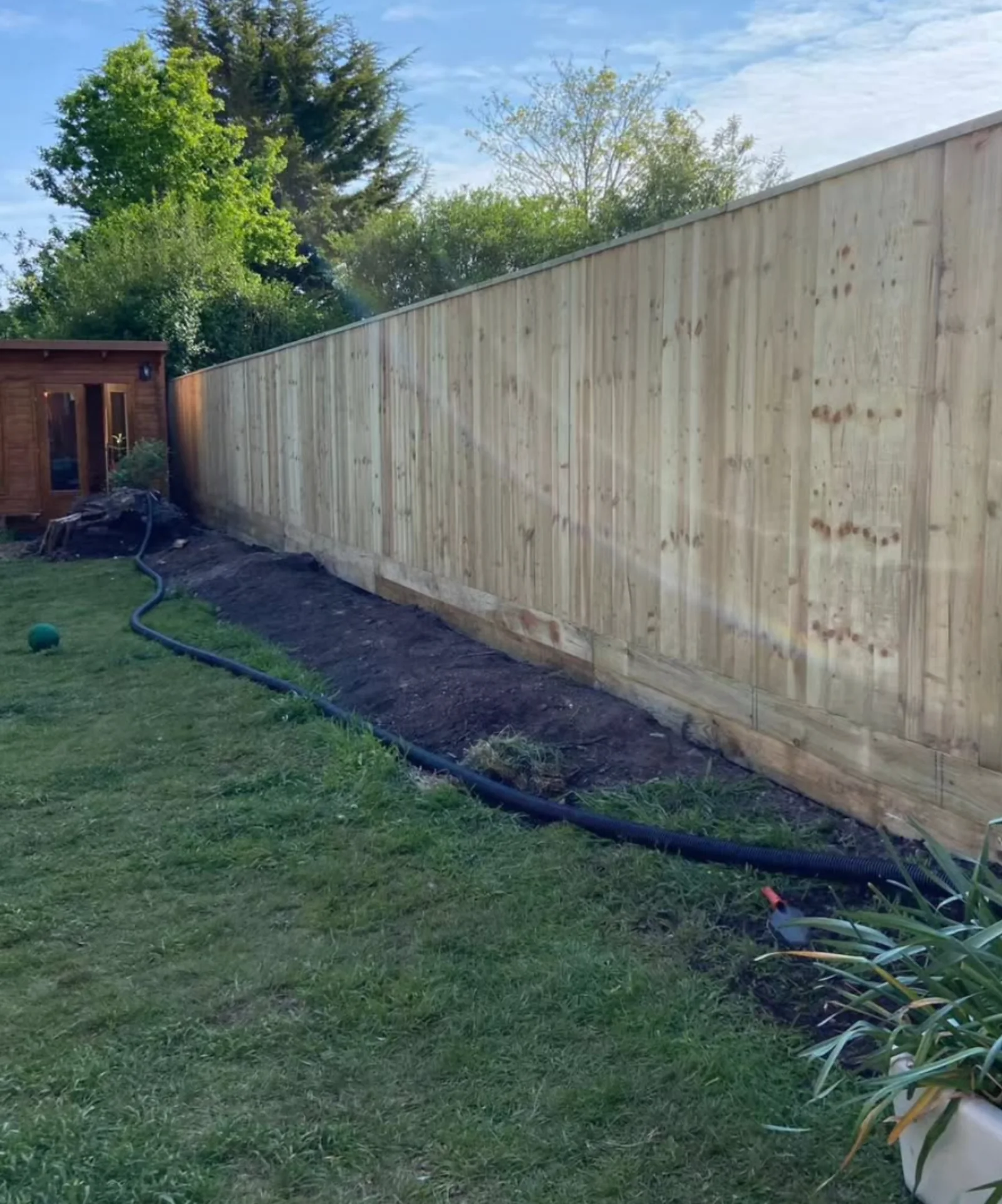 Long timber fence installation by Palmers Garden Care